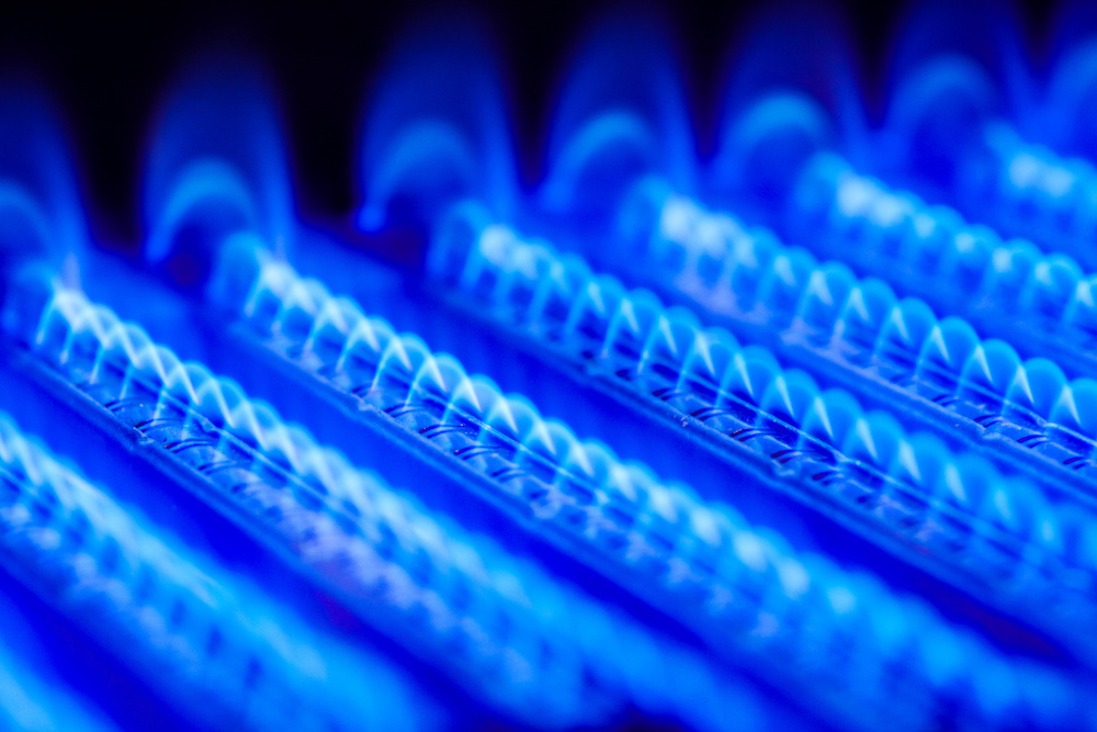 Burning gas in water heater furnace